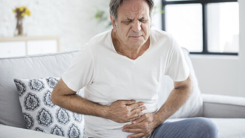 old man in stomach pain