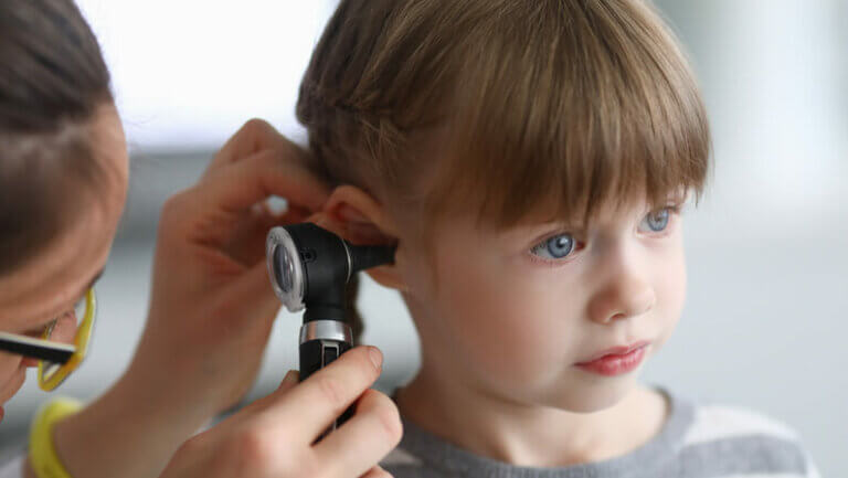 little girl examined for a middle ear infection