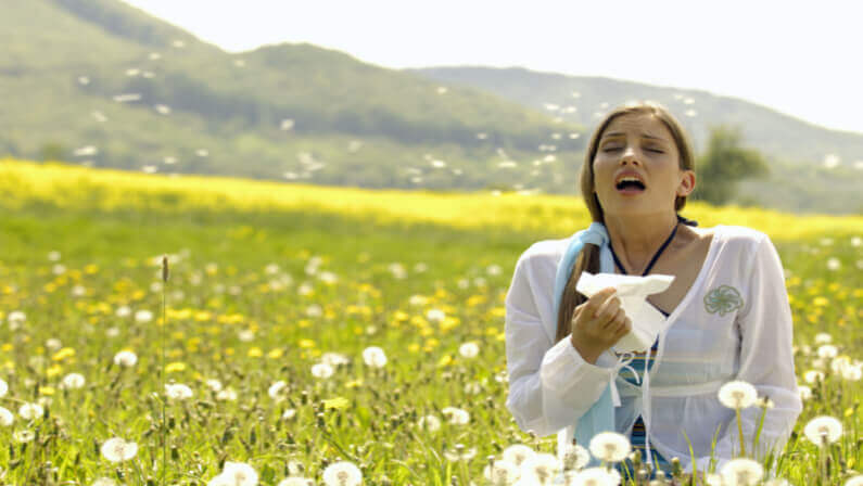 lady in a flower farm hay fever