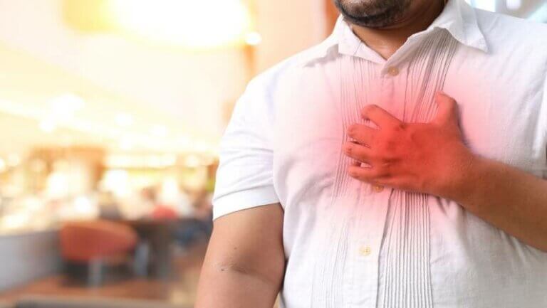 Hands holding chest with symptom heart attack disease