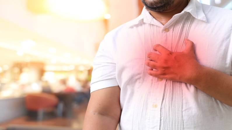 Hands holding chest with symptom heart attack disease