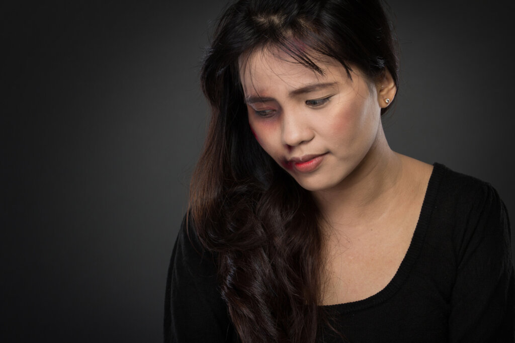 portrait of a asian woman victim of domestic abuse