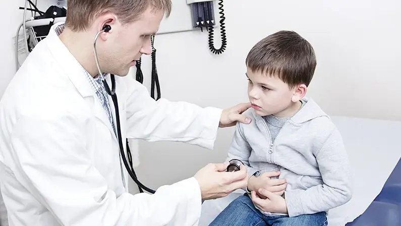 Doctor Examining sick little boy