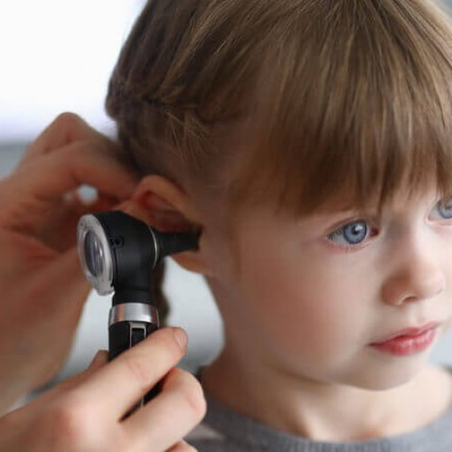 little girl examined for a middle ear infection