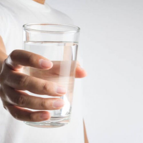 offering a glass of water